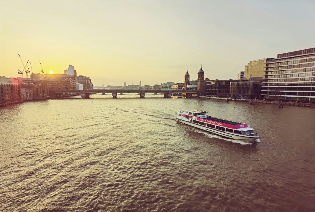 Cruise boat sailing down a London river
